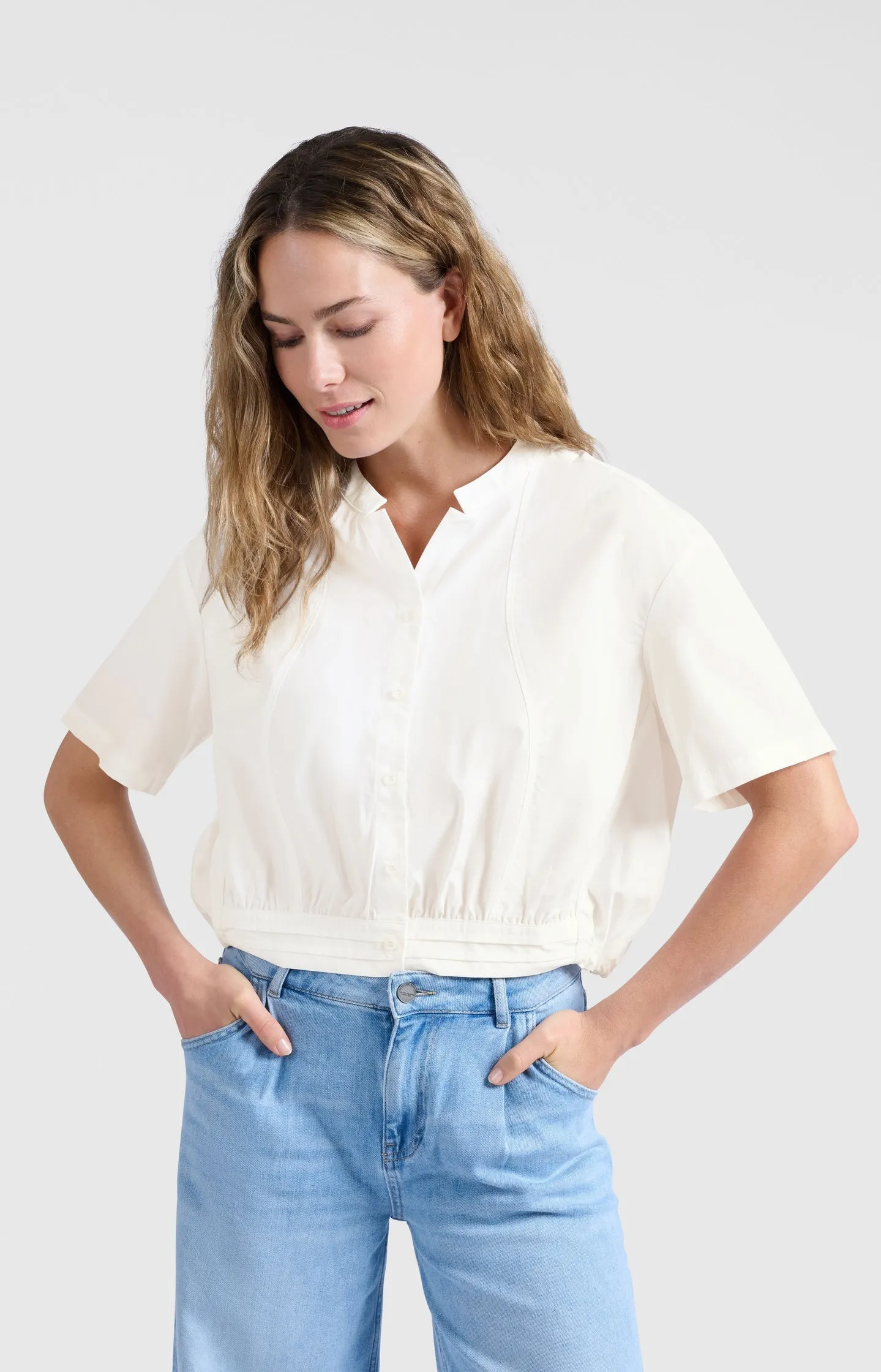 Blouse with drawcord and refined stitching details