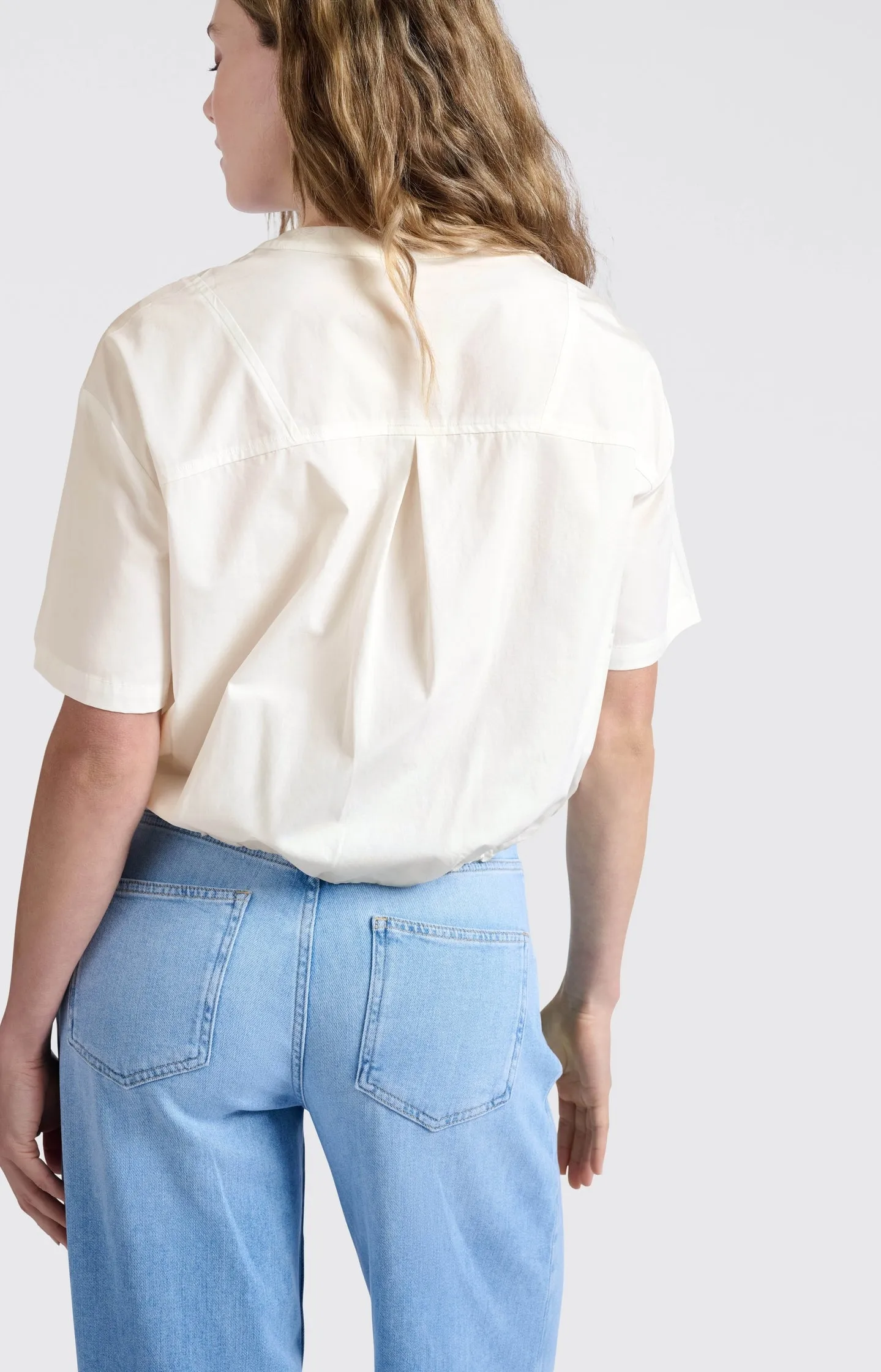 Blouse with drawcord and refined stitching details